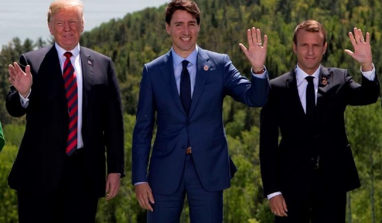 Donald Trump, Justin Trudeau y Emmanuel Macron, en la cumbre del G7 en La Malbaie, Canadá. (AFP)