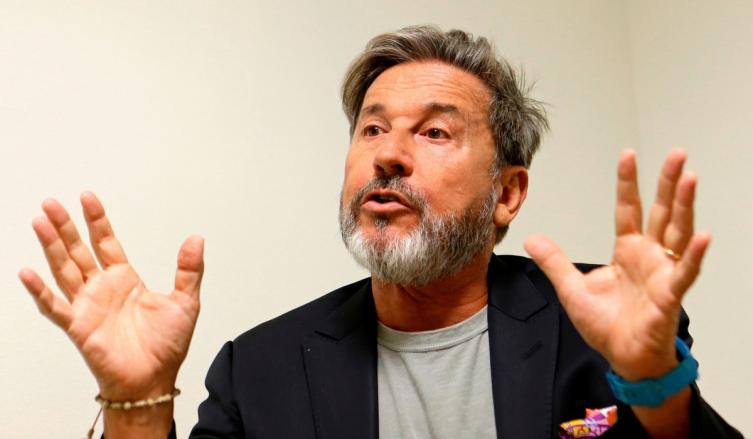 FILE - In this Oct. 24, 2016 file photo, Venezuelan singer-songwriter Ricardo Montaner appears during an interview in Miami. Montaner and the Human Rights Watch organization launched a campaign on Monday, April 9, 2018, asking the people and leaders of La